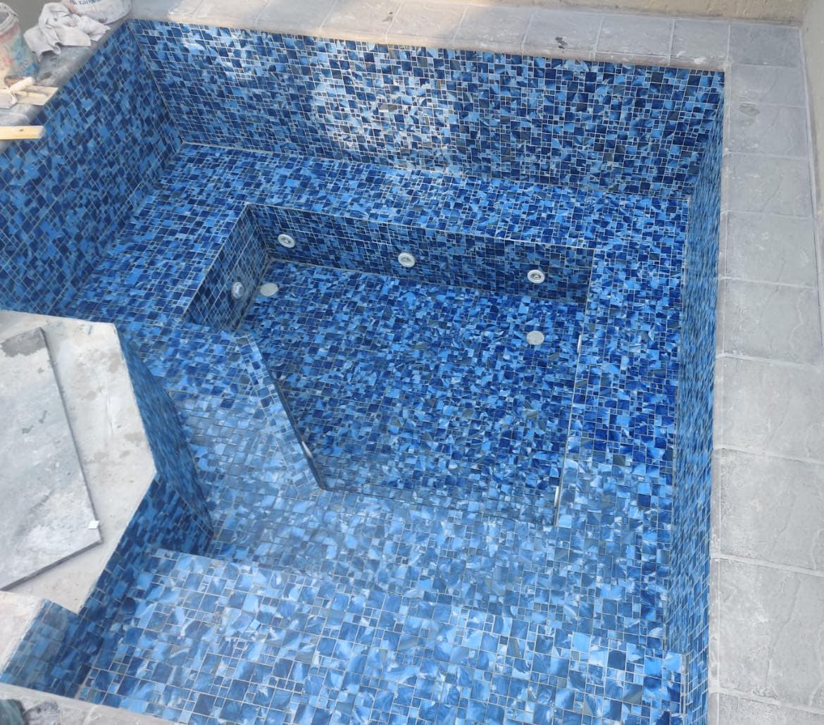 Full blue mosaic-tiled pool interior
